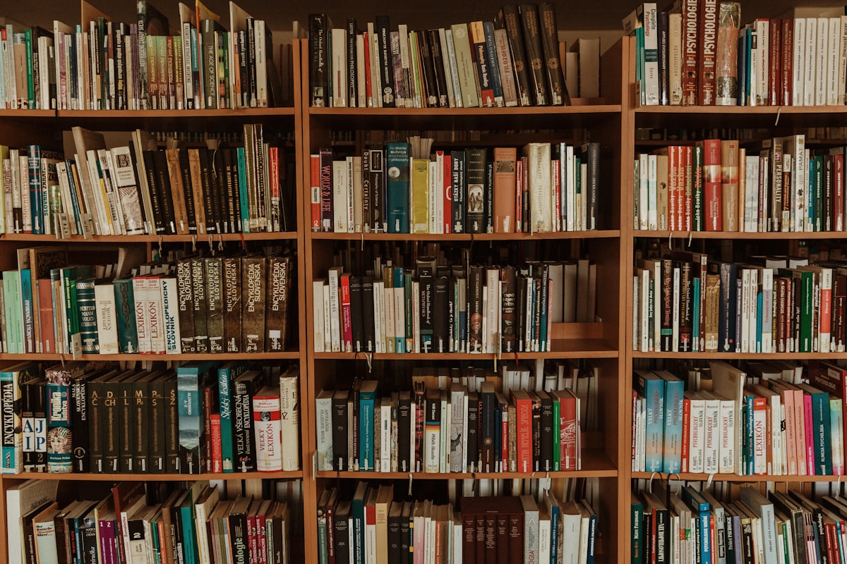 A modern library interior with bookshelves and seating